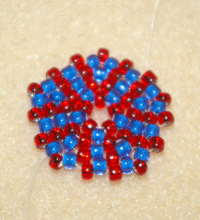 Learn how to do a circular flat peyote stitch in this expert beading blog, step 11, the last step, includes adding one seed bead in each space between up beads as well as between each pair of beads added in the previous row.