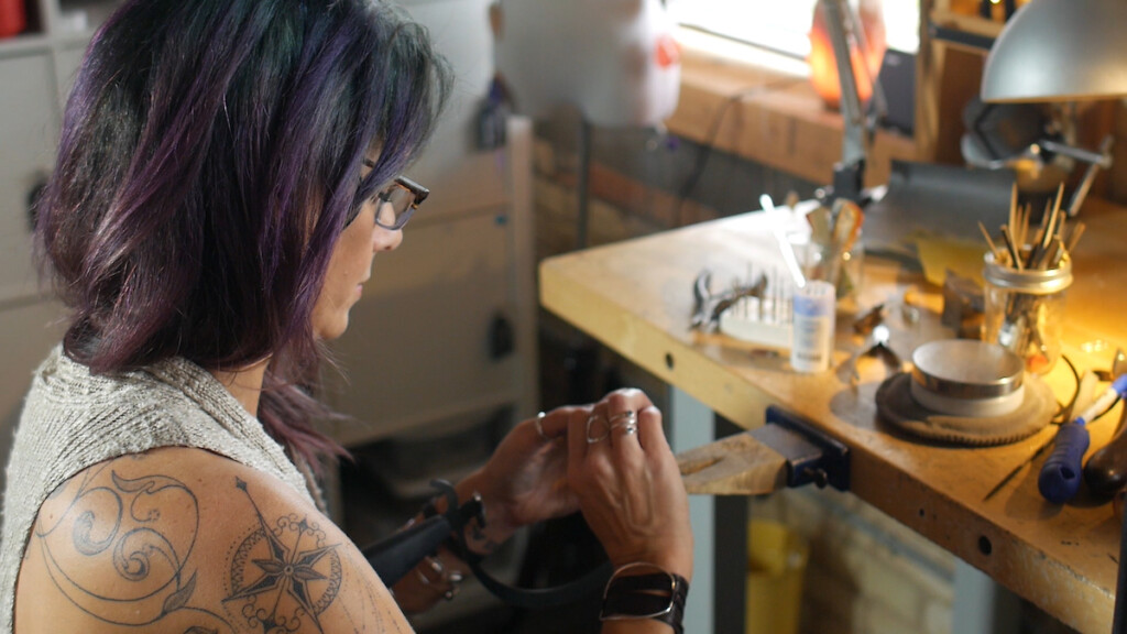 Lisa Lehmann working at her jewelry bench